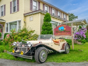 car in front of sign