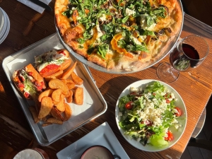 Patrick Henrys pizza and salads on the table 1