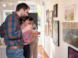 people looking at artwork