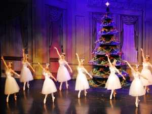 Dancers in The Nutcracker in front of the tree