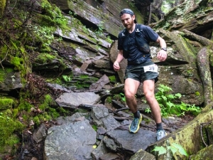 Man scaling boulders