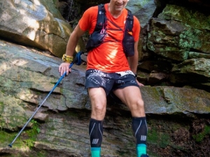 Man scaling boulders