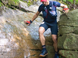 Man scaling boulders