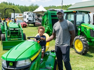 boy with dad and tractor