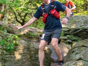 Man scaling boulders