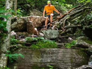 Man scaling boulders