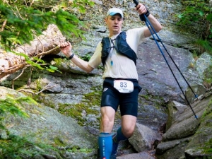 Man scaling boulders