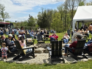 people sitting around fire pit