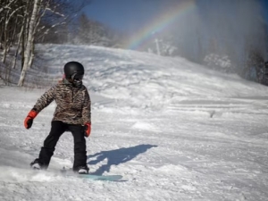 snowboarder with rainbow